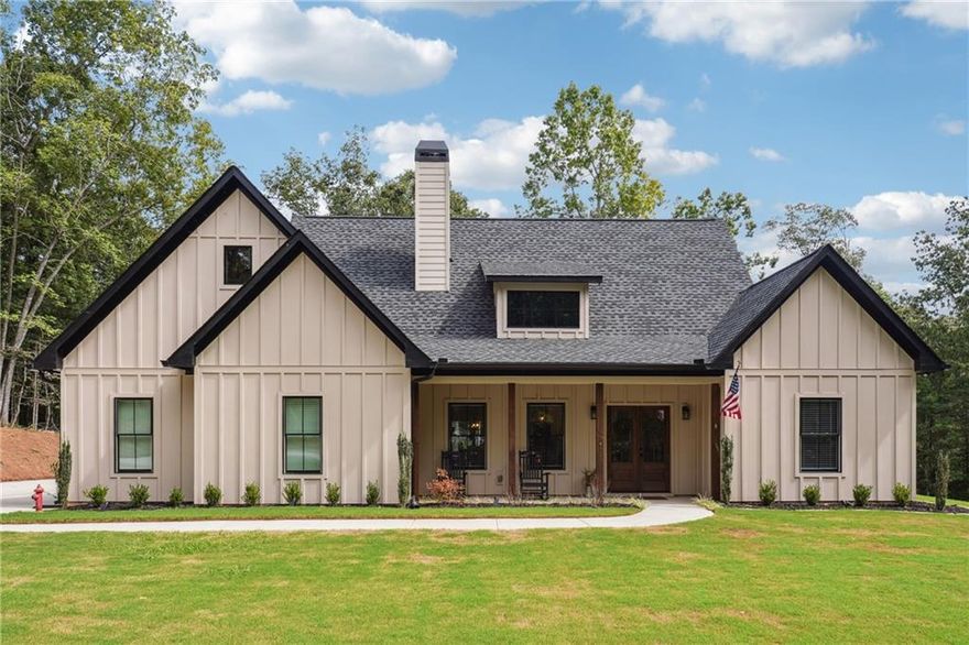 This beautiful home at 7450 Tyree Road in Winston, GA, is the perfect mix of cozy country living and modern style. With 4 bedrooms, 2 baths, and a spacious 5.16-acre lot, there's plenty of room to spread out and enjoy life. The property is very private, and the house is surrounded by beautiful hardwood trees. As you step inside, you will notice the open layout, which is perfect for living and entertaining. The living room has tall, vaulted ceilings and a stunning wood-burning brick fireplace that makes the whole room feel warm and inviting. The kitchen is a dream come true for anyone who loves to cook. It features stylish white cabinets, gorgeous granite countertops, and a big farmhouse sink. There’s even a pot filler over the stove and a herringbone tile backsplash that adds a touch of class. The kitchen island is the perfect spot for a quick breakfast or a casual gathering. The master bath features a shower with large tile. But the fun doesn't stop inside! Step out onto the covered back patio where you'll find a full outdoor kitchenette and another wood-burning fireplace—perfect for a chilly night. The ceiling fan keeps things comfortable on hot summer days. The backyard is a great space for outdoor games or gardening. The home also includes a 2-car garage, and a dedicated 100-amp electrical service on the back of the house, allowing for easy installation of a pool, workshop, or hot tub without interfering with the existing power. For those who travel often, you'll love the location. This home is just a short 38-minute drive from Hartsfield-Jackson Atlanta International Airport, which is about 30.8 miles away. It's also conveniently located just a 17-minute drive, about 9.2 miles, from Interstate 20. For golf lovers, Saint Andrew Golf Course is only a 9-minute drive away, about 3.3 miles.  It's the perfect combination of a peaceful, secluded home that's still close to everything you need.