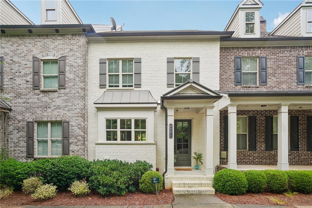 Luxury Townhouse in Encore Walk! Located in the heart of Alpharetta, this beautiful listing sits in an exclusive community of just 38 homes. Enjoy a bright and spacious floor plan with upgraded wood floors, custom built-ins, enhanced lighting, a custom kitchen featuring quartz countertops, a built-in island with ample storage, soft-close drawers and cabinets, and an expansive kitchen window boasting natural light and trees. The primary suite features a large walk-in shower and custom closet built-ins. The finished basement offers a versatile space for guests, work, or recreation. Perfectly positioned near Alpharetta staples - Big Creek Greenway, Ameris Bank Amphitheatre, Topgolf, and Avalon. This home delivers both style and convenience in a truly sought-after setting.