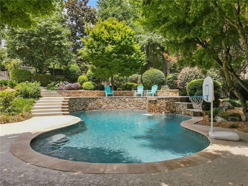 Gorgeous in the Highly Desired Seven Oaks, Minutes away from Shopping & Dining! On almost 3/4 of an ACRE this private retreat is situated perfectly in the neighborhood on a Corner Cul De Sac Lot with an Expansive Open floor plan. Brick Exterior Welcome you as you Enter the Foyer in this Immaculate home w/ Site-Finished Hardwood Flooring. Sunny & Bright Chef's Kitchen w/ Granite Counters, Eat-In Breakfast Bar, Recessed lighting, Gas Cooktop, Built-In Oven/Microwave & Travertine Backsplash w/ Views to the Family Room/Breakfast Room & Views to the Private Backyard w/ Heated Salt Water Swimming Pool. Family Room w/ Vaulted Ceiling with Windows & Brick Fireplace & Built-In Bookcases Overlooks Beautiful Private Yard! The Breakfast Room w/ Wall of Windows offers plenty of Natural Light. Two Spacious Secondary Bedrooms on the Main w/ Full Jack and Jill Bathroom. Formal Dining Room w/ Vaulted Ceilings. The Formal Living Room on the Main is Perfect for Home Office Space. Laundry Room Is located on the Main w/ Plenty of Cabinets and Laundry Sink. Enjoy the Expansive Owners Suite on the Main w/ a Vaulted Ceiling, Separate Walk-In Closet, and a Double Door as you enter the Owner’s Suite Bath w/ Updated Tiled Floor, Dual Vanities, Free Standing Soaking Tub & Separate Tiled Shower! Very Open Finished Terrace Level Offers Two Spacious Bedrooms w/ Full Bathroom (One with Sitting Room so two full beds can fit for extra room for guests). Recreation Room and Flex Room/Office. Basement Storage Room. Private, Wooded, Green Backyard w/ Refreshing Heated Salt Water Swimming Pool w/ Stone Accents and Hot Tub. Back TREX Deck w/ Iron Railing perfect for Entertaining. Expansive Side Yard for Play Area. This home is located minutes to Northview High School, River Trail Middle School and Findley Oaks Elementary are highly ranked. Amenities include a Community Lake, a Clubhouse, Fitness Room, Olympic pool for swim teams, Kids Pool, Sports Court, 8 lighted Tennis Courts, Soccer field, Pickleball, Walking Paths, and Green Area with Gazebo is used for concerts and other events. Upgrade List Includes - Pool Pump (2025) - Pool Cleaner (2023) - Aztec Gravel Landscaping (2023) - Laundry Room Renovation (2023) - Washer/Dryer (2022) - Pool Plaster/Pool Tile (2023) - Outdoor Lighting (2023) - Entry Door/Basement Door/Arched Windows (2025)