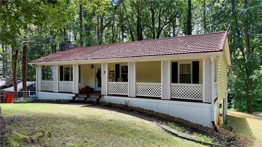 Charming Mountain-Style Ranch with Sunroom, Walkout Basement & Bonus Storage!
Well-built and beautifully maintained ranch home on a quiet dead-end street with no through traffic—just minutes from shopping, dining, and interstates, yet nestled in a peaceful, retreat-like setting. Located in the highly sought-after Creekview High, Creekland Middle, and Avery Elementary School district.
This home features a Gerard fireproof metal roof designed to look like clay tile, locally sourced cedar siding, and gorgeous Brazilian teak hardwood floors throughout most of the interior. The expansive sunroom is a showstopper, offering walls of windows and rare purpleheart hardwood flooring—perfect for relaxing or entertaining.
Enjoy a fully updated bathroom with double vanities, tile flooring, and a new tub. The kitchen includes solid wood cabinetry, and appliances are included.
One bedroom is currently used as a custom walk-in closet, easily converted back to a full bedroom if desired. New vinyl windows, extra insulation, and quality construction throughout ensure year-round comfort.
The home also boasts a full walkout basement with excellent potential for finishing, storage, or workshop use—plus a large shed located beneath the sunroom, providing even more bonus storage space.
This unique home blends character, craftsmanship, and convenience—all in a top-rated school district.