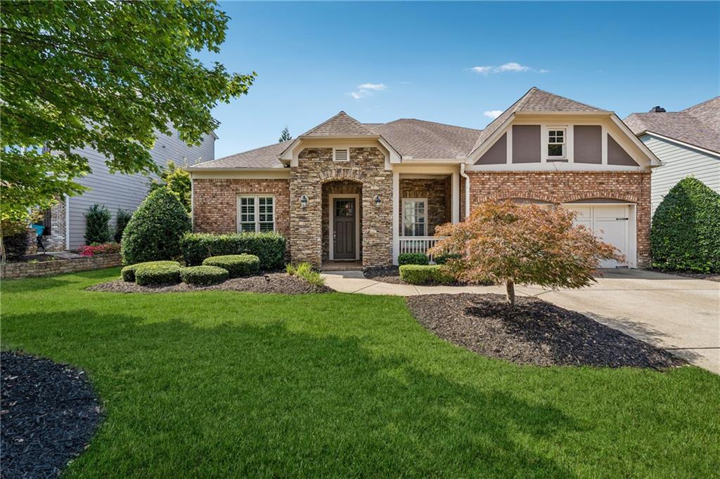 Rare 4 Bedroom / 4 Bath Ranch with Master on Main in Telfair! Step into your dream home in West Forsyth’s highly sought-after Telfair community! This spacious ranch features 4 bedrooms, 4 full baths, and a versatile upstairs bonus suite. From the welcoming front porch to the expanded covered screened porch, every detail is designed for comfortable family living, entertaining, and relaxing in style. Inside, a bright foyer opens to separate formal dining and living rooms, ideal for gatherings. The chef’s kitchen boasts crisp white cabinetry, an oversized island, and a breakfast area overlooking the great room with a stunning marble fireplace. The main level features the oversized owner’s suite with a rainfall shower, his and hers closets, and a soaking tub. The main level also offers two generously sized bedrooms, two full bathrooms, and a versatile office nook—ideal for remote work or quiet study. A cozy sitting room serves as a central space that can be used as a playroom, lounge, or study area, providing both connection and privacy between the rooms. Upstairs, the bonus suite includes a remodeled full bath with and a walk-in closet, offering a perfect space for guests, teens, or a private getaway. Outdoor living is exceptional with an extended screened porch perfect for entertaining family and relaxing year-round. The professionally landscaped yard and wrought-iron fencing add charm and privacy. Recent updates include a brand-new furnace, brand new air purification system with UV, newer roof, HVAC, stainless steel appliances, and fresh interior paint. Enjoy resort-style Telfair amenities: clubhouse with pool and splash fountains, two lighted tennis courts, and a playground. Conveniently located near Vickery Village, Halcyon, shopping, dining, Big Creek Greenway, and zoned for the award-winning West Forsyth High School District. This home truly has it all—4 bedrooms, 4 baths, master on main, modern updates, bonus suite, extended porch, and top-rated schools in an unbeatable location!