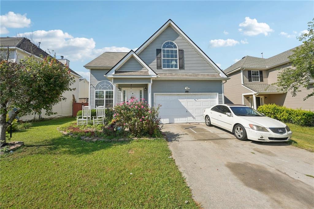 Welcome Home to this fantastic 4 bedroom 2.5 bath 2 story home in the sought after South Hills community. Main level features foyer and hardwood floors, a living room, dining room and spacious separate family room with fireplace. Family room is open to the kitchen featuring white cabinets, stainless steel appliances, tile backsplash, a pantry and bayed breakfast/dining area. The family room also offers access outside to the large poured patio & fenced in yard which serves as an oasis for relaxation and entertaining. Back inside, the main level also offers a half bath and access to the attached to 2 car garage. The upper level offers a spacious primary suite with sitting area and tray ceiling along with an en suite with separate shower and jetted tub and a large walk-in closet. Upper level also boasts 3 more large vaulted bedrooms and the 2nd full bath. Don’t miss this opportunity…Call to schedule your tour today.!!