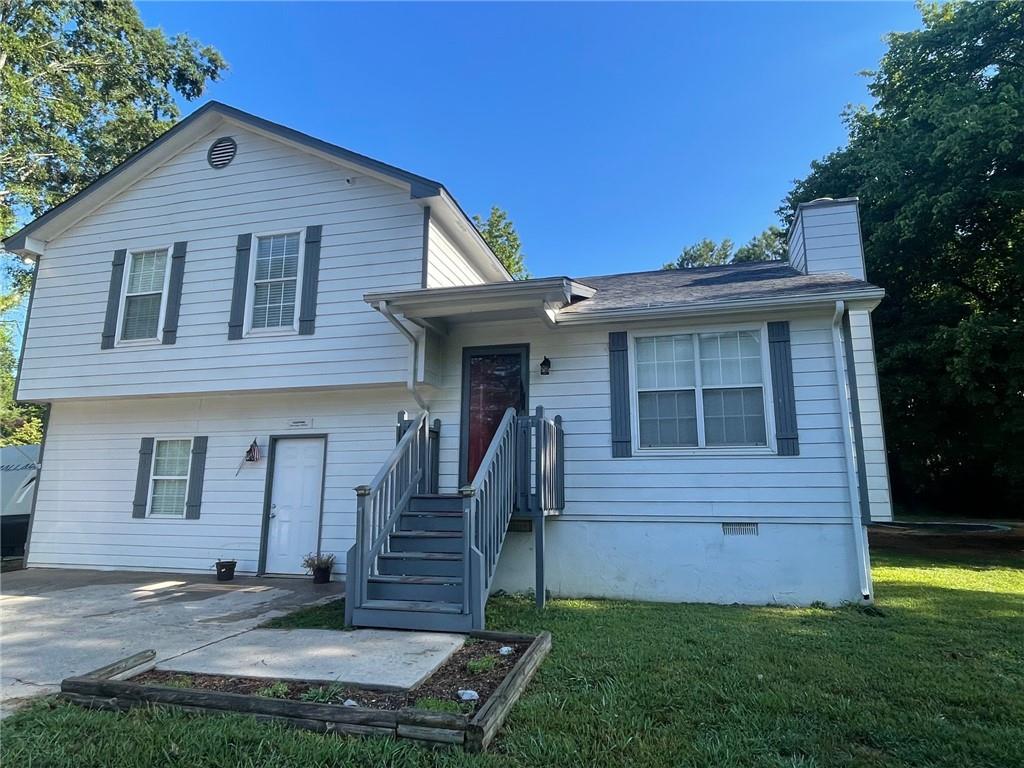Outdoor enthusiasts, look no further. If you would like to be next to a fantastic park, have an above ground pool in your backyard, as well as an in ground trampoline, screened in back porch and a wooded backyard for privacy, you're going to love this deal. This wonderful split level home is located in a prime location in Adairsville across from Manning Mill park. With 4 bedrooms and 2 full baths, plus room for an office, playroom or whatever you'd like, there's plenty of room for all. The upper level has 3 bedrooms with 2 full baths.The main level offers a lovely family room with a wood burning fireplace. The kitchen is also located on the main and offers an eat in kitchen, pantry closet and access to back porch. On the lower level is another large bedroom with a large closet, a bonus room that could be an office, playroom, etc with an exterior door leading to the driveway. The laundry is laso on the lower level and is partially finished for half bath. There is also an outlet for a camper hookup.