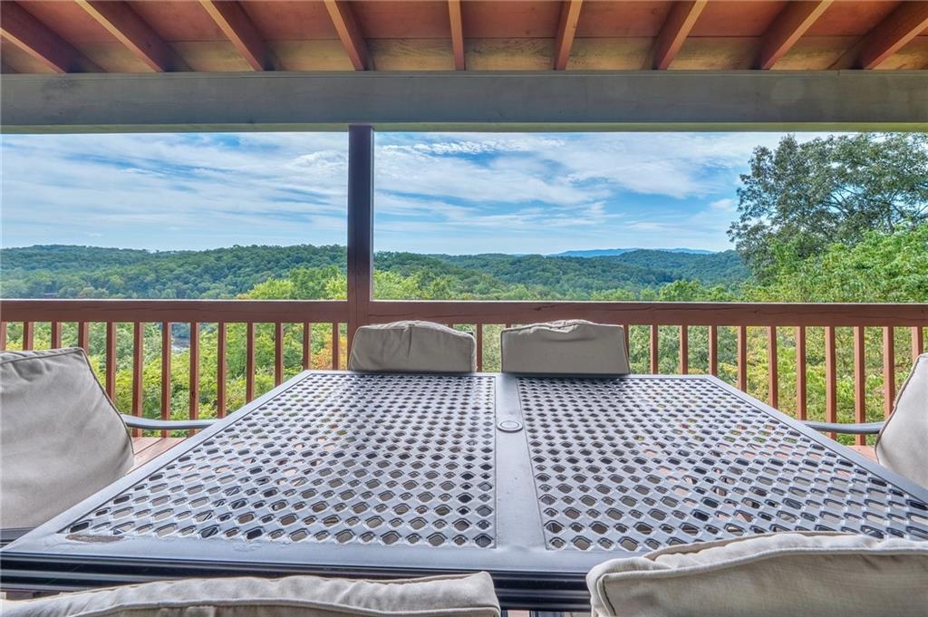 Perched high above the Toccoa River with sweeping long-range mountain and river views, this fully renovated single-family home offers the ultimate North Georgia escape. Located just 10 minutes from downtown Blue Ridge and 5 minutes from McCaysville, this property blends seclusion, luxury, and convenience in one breathtaking package. This fully renovated, 5 acre estate, features 4 bedrooms each with with its own en suite bathroom and spacious walk in closet. Additionally, the home has a fully finished basement with media room, game room, and wood burning stove. Enjoy breathtaking sunsets on the deck with long range moutain views and views of the Toccoa River. Owner is a licensed agent in Georgia. Furnishings negotiable.