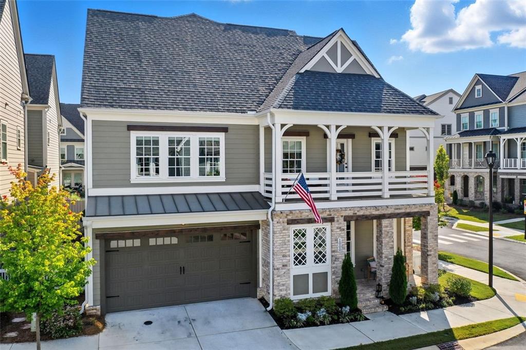 Step into elevated living in South on Main, widely recognized as one of Cherokee County’s most desirable and best-selling communities (Livabl). Situated just steps from Downtown Woodstock—or a short golf-cart ride away—this home offers both unbeatable convenience and stylish living.
This 4 bedroom, 3.5 bath residence spans three levels and is finished with decorator-level aesthetics and thoughtful upgrades throughout. The main level features a stunning kitchen with a large island, quartz countertops, and upgraded GE Café appliances in the highly sought-after flat white finish. The open design flows into the family room, dining area, and a keeping room for additional living space, making the main floor ideal for gatherings.
Upstairs, the master suite feels like a spa retreat with dual his-and-hers closets, a freestanding soaking tub, and an oversized shower. Also on this level are two additional bedrooms: one accented with dramatic barn doors, and another with private access to a covered porch.
The third level adds even more flexibility with a spacious media or bonus room, plus another bedroom and full bath—perfect for guests, teens, or a home office.
Outdoor living is cozy and welcoming, with a corner lot that provides a more open feel and enhanced privacy.
Life in South on Main means enjoying resort-style amenities, including a large clubhouse with gathering and fitness spaces, a resort-style pool with cabana and kids splash pad, barn-inspired community pavilion, gardens, playgrounds, parks, sidewalks, and frequent neighborhood events. It’s one of the most social and walkable communities in Woodstock, where neighbors become friends.
If you’re searching for a stylish, upgraded home paired with one of the most dynamic communities in Cherokee County, this property delivers the complete package.