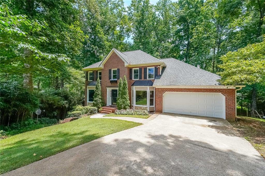 Discover this East Cobb Home, LASSITER School district, Experience the joys of outdoor living with this expanded TREX DECK that offers a view of the secluded backyard.Situated on a cel-de-sac lot, this home boast over 3100 square feet, plus FINISHED BASEMENT with bed & bathroom , flex space, storage room plus opens out to large patio overlooking private backyard. Inside the home NEW Flooring both on main and upper level and fresh paint, NEW HVAC and TANKLESS WATER HEATER, MOST WINDOWS HAVE BEEN REPLACED including all 4 BAY Windows as well as upper level windows, NEW STEEL INSULATED GARAGE DOOR at kitchen level for ease, and so much more. Fantastic Location with Sweat Mountain Park close by. All 3 schools within a short distance. Note: Living room carpet will be replaced with new flooring once pianos have been removed.