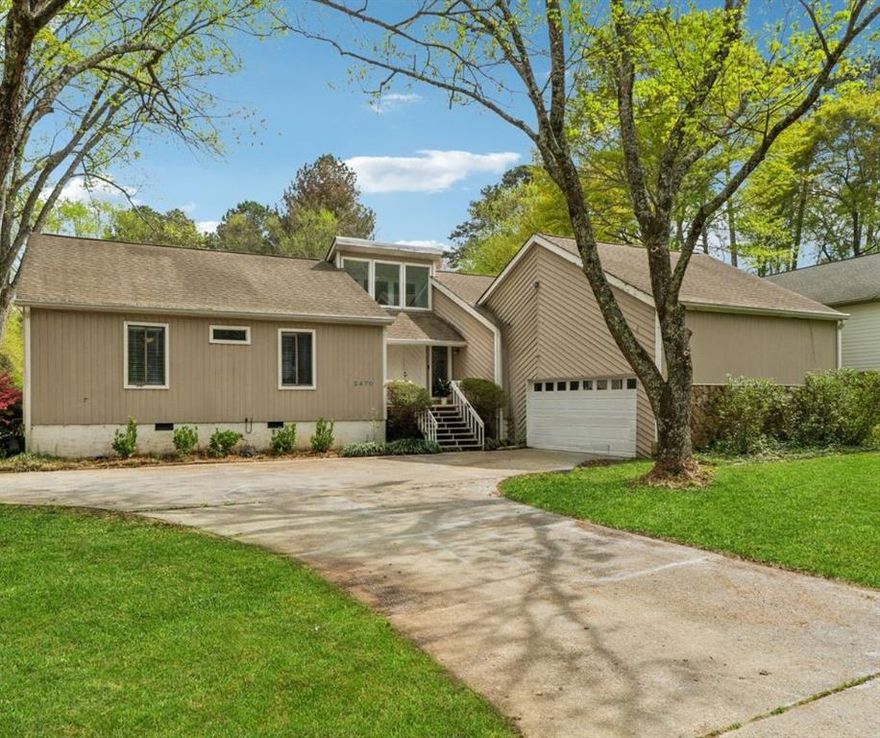 Now is the perfect time to make your next move. This charming raised ranch style home presents the perfect opportunity for you to move into your ideal space. Sweetly nestled in the established Weatherstone community on a large corner lot (just shy of 1 acre). Double wood doors welcome you home to a relaxed and serene atmosphere. Inside the main living space you will find a traditional oversized stone masonry fireplace, vaulted ceilings and built in shelving. Entrance from the garage leads to the laundry room/half bath, as well as a spacious kitchen with stainless appliances, built-in microwave, hooded gas stove top, an ‘eat in’ area with a large ‘picture’ window that overlooks the yard. Additional features include separate dining room, wet bar, and three sliding doors that are strategically placed allowing for unobstructed views of the backyard and easy access to the expansive covered deck. Leveled backyard is your very own private 'playground' and personal oasis complete with a detached shed (wired for electricity). The owners’ suite is a haven for rest and relaxation with its own sliding door that gives private access to the deck. The ensuite is complete with double vanity, soaking tub, separate shower, bidet, and a skylight to top it all off. Two secondary bedrooms are just across the hall, separated by a full bath with ample storage, white cabinets and granite countertops. One of the bedrooms has a ‘cozy’ loft that’s ideal for curling up with a good book, or simply indulging in some ‘me time’. Top rated east Marietta schools. Swim/ tennis/racquetball community. Perfectly located~ less than 5 minutes to Terrell Mill Park, and Sewell Mill Park. Very short drive to Townsend Trail, Sope Creek Paper Mills Ruins, Cochran Shoals Trail. Minutes to i-75/285, Truist Park/The Battery, Marietta Square.