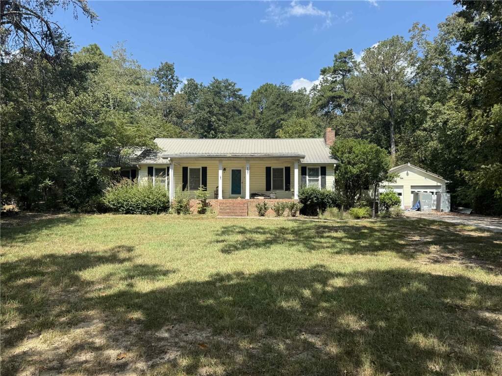 3-bedroom, 2-bath home with 2,008 sq ft on 0.68 acres in Rockmart. Built in 1980, this property includes a 2-car detached garage, fireplace, metal roof, screened back porch, rear deck, and underground pool requiring repair. Conveniently located near schools, shopping, and major routes. This porperty is in need of cosmetic repairs. More interior pcitures coming soon.