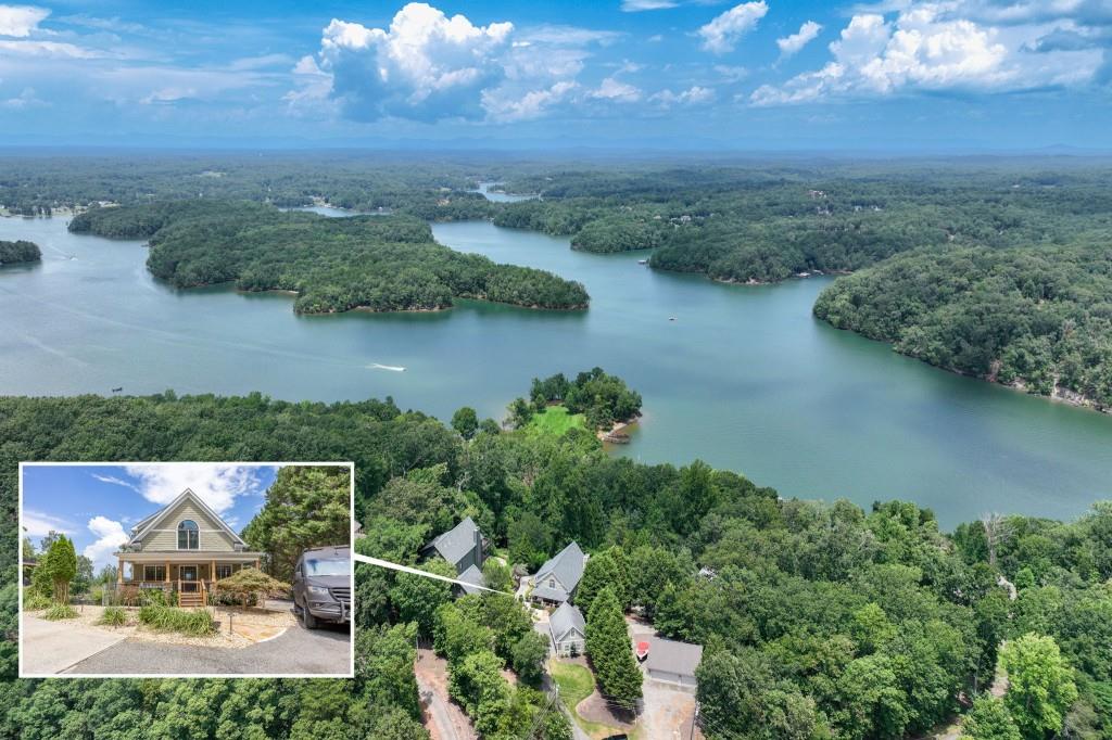 This stunningly renovated Lake Lanier retreat boasts lake and long-range North Georgia Mountain views! With 4 bedrooms, 4 full baths, an incredible flex space and resort-style amenities, this one of a kind property is perfect as a full-time residence, weekend escape, or short-term rental investment. This exceptional home has been completely renovated from top to bottom, with no detail overlooked and no expense spared. Perfectly positioned on deep, open water, it offers breathtaking views, a custom infinity saltwater pool, outdoor kitchen, a 32' x 32' double-slip dock with a party deck, boat lift, and two jet ski ports. Inside, the grand two-story great room impresses with floor-to-ceiling windows, gorgeous wood beams, and a striking custom stone fireplace. The chef's kitchen boasts top-of-the-line appliances, quartzite countertops, custom cabinetry, and an oversized island with waterfall edge, all part of an open, light-filled floor plan. Two guest bedrooms and a full bath are comfortably located on the main level as well. The private primary suite offers a luxurious, spa-inspired en suite bath, creating a serene retreat. The finished terrace level features 10-foot ceilings, a spacious media/rec room, a custom bar, full bath, guest bedroom, and access to a covered patio overlooking the sparkling saltwater pool. The detached garage includes a full bath and flex room above the garage, ideal as a guest suite, office, in-law or teen suite or bunk room. Ample parking ensures comfort and convenience for you and your guests. Designed for entertaining, this lakefront home features two expansive decks and an outdoor kitchen complete with granite island, beer tap, prep sink, refrigerator, stainless grilling station, and weatherproof flat-screen TV, ideal for watching the game poolside. Whether you're boating, lounging at the dock, soaking up the sun by the gorgeous saltwater infinity pool with built-in hot tub and waterslide, or simply taking in the serene lake and mountain views, this home offers the ultimate in lakefront living. All furnishings, the ATV, and the 2023 Tritoon are available for purchase, making this an incredible opportunity to step right into the lake lifestyle. Plus, it's conveniently located within minutes of GA 400, shopping and restaurants, but feels worlds away!