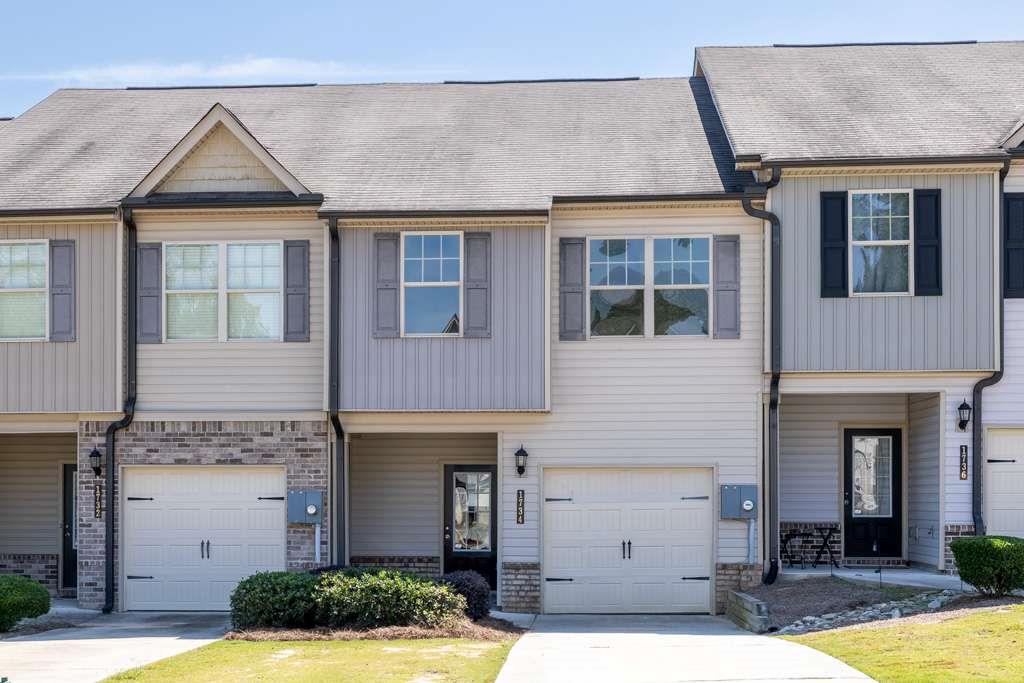 Freshly Updated Townhome! Step inside to an inviting open-concept living space featuring brand-new paint and flooring throughout, plus a cozy electric fireplace for added charm. The spacious kitchen and living areas flow seamlessly, perfect for entertaining. Upstairs, retreat to the large master suite with a luxurious en-suite bathroom and a generous walk-in closet. Two additional bedrooms share a full bath, providing plenty of space for family, guests, or a home office. Agent related to Seller.
