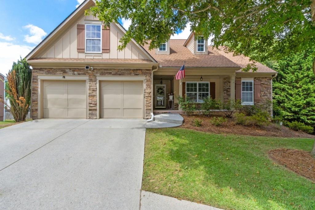 Welcome to this light-filled ranch in award-winning Gwinnett County schools. This 3 bed/2 bath home boasts a new roof and HVAC, hardwood floors throughout the main level, and an open kitchen with newer appliances and vaulted ceilings. The basement offers a ready-to-finish 4th bedroom with plumbing and exterior access perfect for an in-law suite or rental, with no restrictions. Enjoy a private, level backyard and covered patio. Conveniently located near Hwy 985/85, Mall of Georgia, dining, and parks.