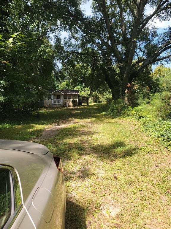 SOLD AS IS 2/1 in the Heart of Atlanta on 2 lots . CALLING ALL INVESTOR OR FIX AND FLIPPERS this is a quick sell on 2 building lots , you can come in and make this a dream .