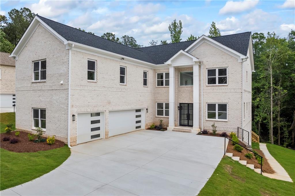 Discover the pinnacle of modern living with this meticulously crafted 4-sided brick modern transitional new construction home in the prestigious Le Jardin community. This home exudes elegance from the moment you step into the sun-drenched 2-story foyer, revealing captivating views of the grand 2-story great room. The main level seamlessly blends sophistication and functionality with a formal dining room, a versatile home office, and a chef-inspired kitchen. Complete with oversized quartz countertops, a gas stovetop, built-in microwave, breakfast nook, and ample storage, the kitchen is designed to impress and perform. The open-concept great room features an eye-catching accent wall with a fireplace and flows effortlessly to the expansive covered deck, ideal for relaxing or entertaining. Thoughtful design continues with a private guest suite on the main level, offering comfort and privacy. Upstairs, the owner's suite is a sanctuary of luxury, featuring an oversized walk-in closet and a spa-inspired bathroom with exquisite marble-motif tile. Three additional bedrooms, including a Jack and Jill suite, ensure space and convenience for family or guests. Unleash your creativity with the unfinished basement, ready to accommodate your custom vision, while the back patio invites you to enjoy serene outdoor moments. Perfectly situated just minutes from Camp Creek Marketplace, this home offers unparalleled access to Target, Starbucks, restaurants, and more. It's also conveniently close to the airport, golf courses, downtown Atlanta, and within 30 minutes of the highly regarded Woodward Academy. Enhance your buying experience with up to $5,000 in builder concessions when using our preferred partners, Toshia Parrish with Assertive Mortgage and The Hawes Law Firm. Act early to personalize select design finishes and make this extraordinary home uniquely yours. Estimated Completion: JUNE 2025.