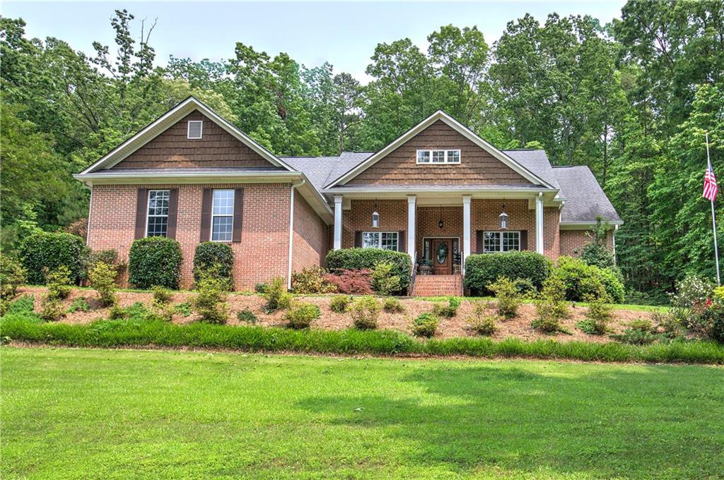Welcome Home!
This beautifully maintained four-sided brick ranch sits on over an acre and is truly move-in ready. Featuring four spacious bedrooms and three full bathrooms, the home offers hardwood floors throughout, custom cabinetry, a large living room with a beautiful brick fireplace, and a generous upstairs bonus room with its own full bath—ideal for guests or a teen suite. Step outside to your private backyard retreat, complete with an in-ground pool, covered patio, and fully fenced yard—perfect for relaxing, playing, or entertaining. Blending comfort, charm, and functionality, this property offers spacious living and peaceful surroundings you’ll love coming home to—all while still being conveniently located near downtown Cartersville.