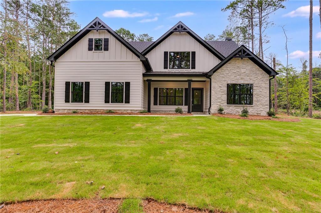 NO HOA & NO CITY TAXES! Lovely Home in Lovely N'hood on Lovely Wooded Lot - Get the BEST deal in the neighborhood with this Owner's Suite and Secondary Bedroom Plus Full Bathroom on MAIN LEVEL - Great Room has vaulted ceiling with stone wood burning fireplace - Kitchen with Central Island and Designer Finishes and Stunning Lighting Package - REVwood throughout common area main floor level - Formal Dining Room - Laundry Room - Upstairs has two HUGE Secondary Bedrooms, Bonus Room and Full Bathroom - Spray Foam Insulation in Attic, Zoned HVAC - Covered Back Patio - EXCELLENT Warranty Program - So much to love with this home - It's BEAUTIFUL to put the cherry on TOP!