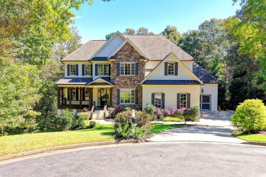 YOUR AWARD WINNING GARDEN & GUN RIVER LIFESTYLE DESIGNER ESTATE ON 2+ ACRES with Saltwater pool & spa awaits! Be sure to scroll down for the VIRTUAL TOUR! Cul-de-sac lot bordering ACRES of unbuildable greenspace and the Chattahoochee River! FINISHED TERRACE LEVEL. 3 CAR GARAGE with charging option! FRESH PAINT, REFINISHED FLOORS, MOVE IN READY! Fishing pond access from the property! Stone, brick, cedar and wood come together in custom craftsman artistic detail for this 2015 completely custom southern dream oasis built exclusively by Callaway Custom Homes. Combined open shelving and closed furniture quality cabinetry in the kitchen. Chef inspired pro stainless appliance package, wine rack, oak flooring throughout, industrial country french accents and completely designer selected unique one of a kind lighting.  Classic white carrera marble counters and granite vanities throughout. Cedar and brick interior accents.  The estate is adorned with custom millwork throughout and custom sliding doors! From entry paneling to the living room, to solid shiplap in the family room, kitchen and terrace level.  PORCHES!  Front covered porch, back screened porch flowing to completely private BBQ deck!  The Owner's Suite is a complete oasis with full sitting room, endless green forest and pool views, and a spa inspired marble bath that is a true retreat. Claw foot iron and pewter soaking tub with coordinating hardware, furniture inspired double vanities and brushed gold lighting. Walk in closets throughout the home, built in shelving throughout, and unique architecture.  Each bedroom has full bath access.  The home features a FULL spacious bedroom on main level with full bath ensuite.  The terrace level features second kitchen custom bar and 6th bedroom ensuite with palatial ceilings and custom built in finishes.  The terrace is accented with brick, custom metal bar with wood and shiplap.  The media room spares no detail with brick and industrial chic lighting.  The home features a 2015 custom salt water infinity pool and hot tub surrounded by stone planters and pavers, and is one of a kind and features a stacked stone masonry wood burning fireplace. It does not stop with the home...the community is a River Club oasis of nature equestrian trails, river access, equestrian boarding facilities with active riding programs nearby, swim, tennis, pickleball, baseketball, amphitheater, park and local golf course!  Convenient walking access to the local award winning charter elementary and middle schools! You can walk to Lake Lanier and the Buford Dam from community trails.  The community neighbors the Trout Hatchery and Wildlife Nature Center for the Chattahoochee River, with immersion into nature as a lifestyle.  Cue the deer and rabbits, they are part of the community.  **Details indicated to be verified by buyer**