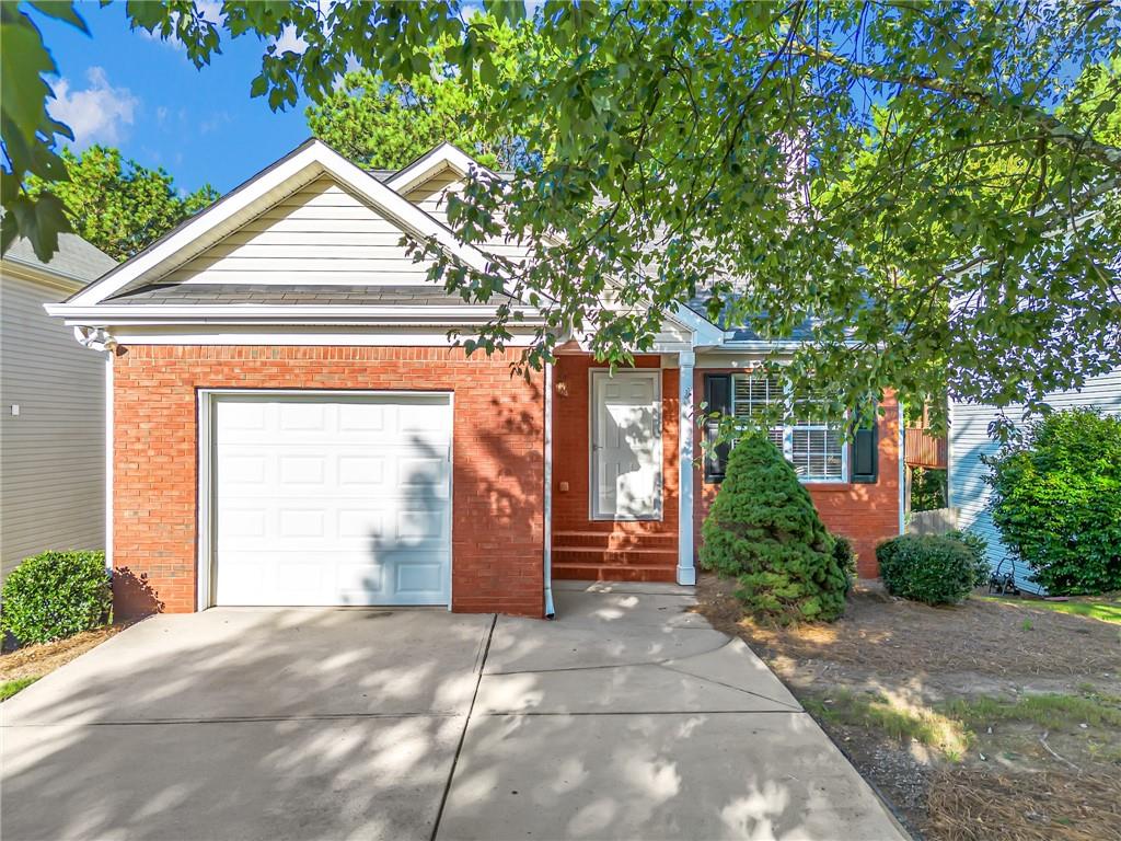 Welcome to this stunning 4-beds/3-baths home in the sought-after Towne Lake neighborhood in Woodstock, GA. Recent updates have made this home even more move-in ready, including a pressure wash of the entire home, new LVP flooring, new carpet and touch-up paint. Inside, the living room features vaulted ceilings and a decorative fireplace, providing a cozy and welcoming atmosphere. The dining room flows seamlessly into the back deck. The kitchen is a chef's dream with wood cabinets, granite countertops, and stainless steel appliances. The master suite on the main level offers a WIC and a private full bath, creating a retreat-like space. Upstairs, you'll find a large 3rd bedroom, ideal for a guest room or home office. The lower level includes a bonus room, another bedroom, and a full bath, offering plenty of space for family or guests. This home is located in the highly-rated Cherokee County School District and provides easy access to I-575 and Highway 92, making commuting a breeze. Don’t miss out on this beautifully updated home—schedule your showing today! Some photos have been virtually staged to illustrate potential furniture placement.