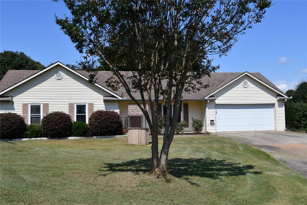 NO HOA! Beautiful 3BR/2BA stepless ranch on nearly 1 acre level, fenced very private cul-de-sac lot. Extended driveway offers additional parking and home sits back on the lot for excellent curb appeal. Covered rocking chair front porch, entrance foyer opens to family room with fireplace. Kitchen offers plenty of counterspace, pantry, laundry closet and breakfast bar. Dining area is currently used for a home office, sliding glass doors and view to back yard patio. Owner's suite with walk in closet, owner's bath features garden tub and separate shower. Secondary bedrooms share a full guest bath and have ample closet space. You will love the very private, level and fenced back yard with a variety of fruit trees, garden areas, a large storage shed and room for a pool. USDA Eligible. Minutes to shopping, restaurants and convenient to Hwy 211, I-85, and Hwy 316.
