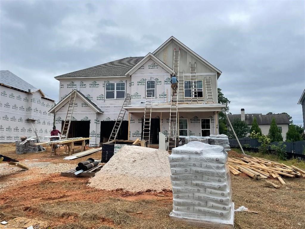 Introducing a brand-new construction in East Cobb! This 5-bedroom, 4-bathroom home also boasts a media room. **Photos are of similar home** Home will be ready in Nov 2025. It's been meticulously crafted with numerous custom upgrades. The grand two-story foyer leads to an elegant formal living and dining room. The kitchen is a highlight, featuring a custom island with white cabinets, a custom vent hood above the cooktop, stylish tile backsplash, quartz countertops, and a stainless steel double oven appliance package. The main level showcases beautiful hardwood floors throughout (except in one bedroom), extending to the stairs. The master suite is a retreat, showcasing, a semi-frameless shower enclosure, and a generously sized walk-in closet. Upstairs, you'll find three more bedrooms, two full baths, and the media room, as well as a convenient laundry space. This home offers an exceptional living experience in East Cobb.