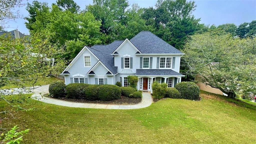 Rare opportunity to own this stately two-story home in the heart of Towne Lake, just minutes from Downtown Woodstock's dining, entertainment, shopping, outlet mall, Lake Allatoona, and Olde Mill Park! Nestled in the highly sought-after, established Deer Run North community, this home offers resort-style amenities including a pool, pickleball, tennis, basketball, clubhouse, and scenic walking trails. Located within top-rated school districts with easy access to I-575 for a smooth commute to Atlanta or the North Georgia mountains. Recent updates include a new roof, fresh interior paint, and an upgraded back deck. The home welcomes you with a grand two-story foyer, separate dining room with bay window, and a office/study also with a bay window. Hardwood floors span the main level, leading into a stunning two-story fireside family room with open railing view to the upstairs. The bright, open kitchen features white cabinetry, stainless steel appliances, and tile flooring. The main-level primary suite boasts a vaulted ceiling, walk-in closet, and a private bath with double vanity, garden tub, and glass-enclosed separate shower. A guest half bath, laundry room, large storage closet, and side-entry two-car garage complete the main level. Upstairs features a hardwood hallway, three spacious secondary bedrooms, a guest bathroom with double vanity and tub/shower combo, and a large walk-in attic space above the garage, perfect for storage or potential future expansion. Two additional closets offer even more storage. Enjoy outdoor living on the extended deck and patio overlooking a private, fenced backyard surrounded by mature trees, creating a serene retreat. This vibrant swim/tennis community with sidewalks throughout is the perfect place to call home, don't miss this one-of-a-kind opportunity; schedule your private showing today! Special Buyer Incentives Available! Take advantage of the Buy Before You Sell Program, enjoy a one-year temporary rate buydown (1% below market rate) OR a closing credit at no cost to the buyer, courtesy of Mark Baker/SWBC Mortgage.