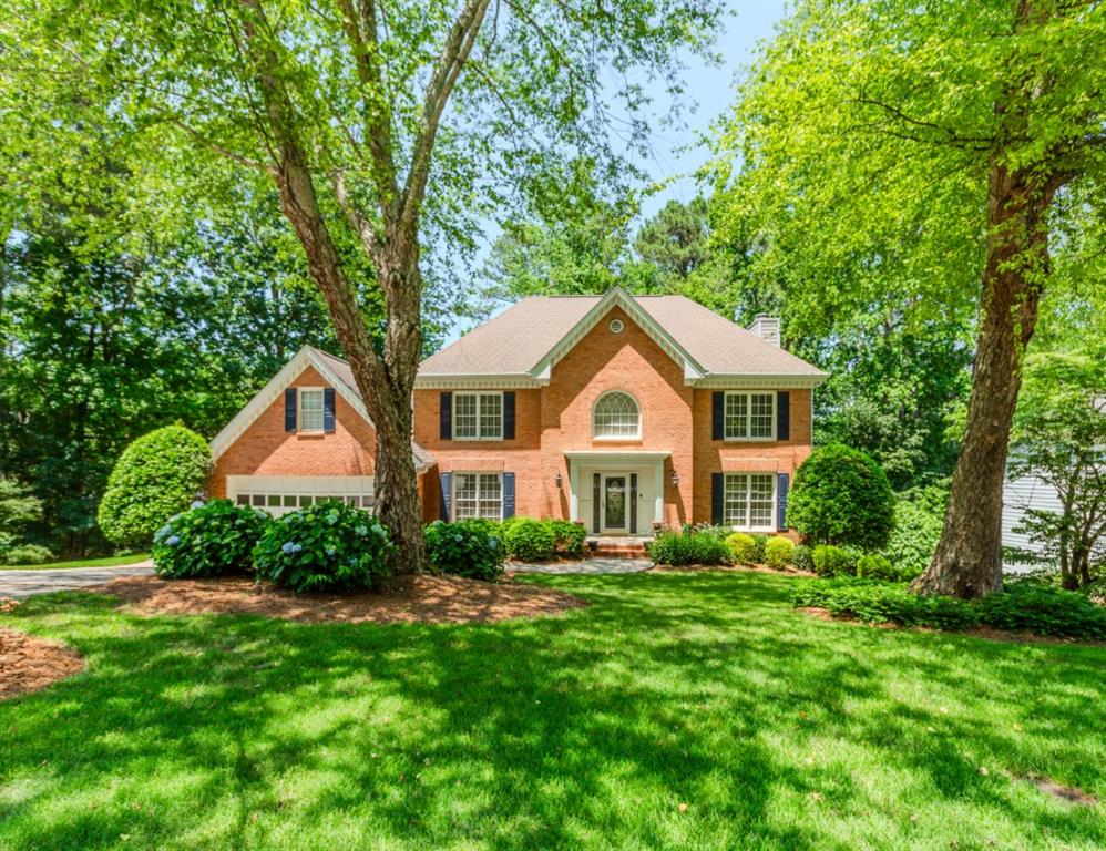 Welcome to this stunning two-story home, nestled in a private cul-de-sac in the sought-after Buckingham Subdivision. Set on a beautifully landscaped, parklike lot, this property offers both charm and functionality throughout. Step into a grand foyer that flows into an oversized dining room perfect for hosting. The spacious kitchen boasts white cabinetry, a rich stained island, double ovens, upgraded appliances, and a generous breakfast area overlooking the serene backyard. The inviting family room features a cozy brick fireplace and plenty of natural light. Upstairs, you'll find a luxurious master suite complete with a trey ceiling, French doors, and a spa-inspired master bath featuring double vanities, a separate shower, a garden tub, and a large walk-in closet. Three additional guest bedrooms, an updated full bath, and a versatile bonus room ideal for a home office, gym, or playroom complete the upper level. The finished terrace level is an entertainer's dream, offering hardwood floors, a media room, recreation room, fitness space, and a private study with custom built-ins and a second fireplace. Enjoy outdoor living with a spacious deck and poured patio perfect for relaxing or entertaining. This home also includes a two-car garage and is located in the highly desirable Collins Hill school cluster, just minutes from Collins Hill High, parks, shopping, the Mall of Georgia, Coolray Field, and major highways.