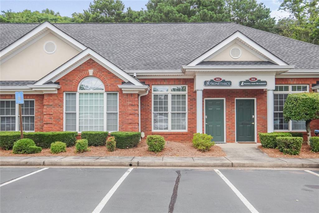 Beautifully Updated Unit in beautifully kept Office Park, which offers access from both Crossville (Hwy 92) and Crabapple Roads. The front Reception adjoins a light-filled Conference Room/Display Area/Admin Office with upgraded barn door. The connecting hallway leads to 3 other spacious offices, a wet bar/kitchenette and private restroom, and a small storage/file/workroom. New Wood Laminate Flooring throughout with fresh Neutral Gray Walls. New Counters and Bathroom Vanity updated in past 2 years. Located close to central mailbox hut. This 25 building office park features nearly 125,000sf of individually owned office condos and offers attractive retail in front of the park, including a wine bar, BBQ restaurant, pharmacy, auto maintenance shop, QuikTrip and much more! Office Park is located close to Historic Roswell offering many lunchtime dining and client entertaining options. Low condo fees of approx. $155/mo include water, sewer, trash, roofs, exterior maintenance, building insurance, and landscaping. Perfect office for you or as an investment opportunity! NO rent restrictions!