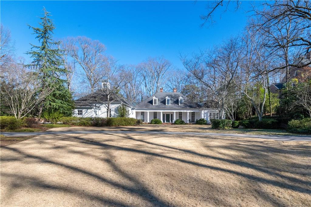 Stunning Yong Pak designed one level home on +/- 2 acres with very high vaulted ceilings and gorgeous details. Located on one of the most prestigious streets in Tuxedo Park, this home sits way back from the street and has a very private flat lot. Perfect site for an infinity pool in the back off of the patio. The home is U shaped with main living rooms in the middle and two bedroom wings on the sides. All bedrooms are flooded with natural light and quite large. The master has his and her closets and bathrooms and is adjoined by a beautiful paneled private den. Beautiful hardwood floors and great floorplan!! This is a truly spectacular home with unlimited potential - a real treat to see!