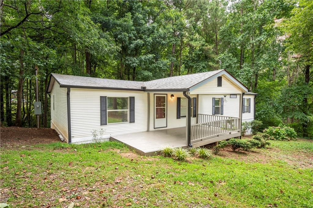 This charming 3-bedroom, 2-bath mobile home is nestled on a private, level 0.64-acre lot just off Talking Rock Road—less than a mile from Highway 515. Thoughtfully laid out for comfortable living with new carpet, fresh paint and some new lighting this home features a spacious kitchen with abundant cabinet space, a formal living room, separate den, and a dedicated dining area. Enjoy outdoor living on the inviting front porch and take advantage of the flat, usable yard—ideal for play, pets, or gardening. Whether you're looking for an affordable family home or a smart investment property, this one offers a convenient location and great privacy!