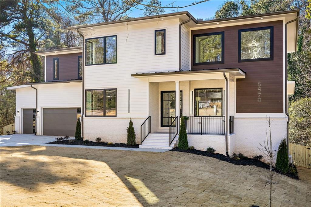 Don't miss out on the incredible opportunity to own this beautifully designed dream home nestled on a spacious 0.537-acre lot in the sought-after Hammond Hills neighborhood of Sandy Springs. Boasting an exceptional indoor/outdoor living space, this residence is a haven for those who love to entertain. The expansive open layout encompasses a versatile study/bedroom  with a full bath, a generously sized family room, a covered outdoor lounge, a chef’s kitchen, a mudroom, and a convenient 3-car garage. Inside, you'll discover a blend of luxury features, including high ceilings, oversized windows, wide plank hardwood flooring, designer lighting, custom cabinetry, and contemporary finishes. The chef’s kitchen is a culinary delight, equipped with top-of-the-line stainless steel appliances, custom cabinets, quartz countertops, a spacious island, a meticulously designed walk-in pantry, and an open dining room perfect for entertaining.  Step into luxury with the primary suite of this exceptional dream home. This sanctuary on the second level is a true retreat, offering an unparalleled level of comfort and sophistication. The spa-grade bathroom features featuring high-end fixtures, a spacious walk-in shower, a luxurious soaking tub, and designer finishes that create a serene atmosphere. There is also a loft area and three sizable bedrooms each with private ensuites to complete the upper floor. Beyond the lavish interiors, step outside to discover the expansive and inviting backyard that complements the grandeur of this dream home. Whether you envision hosting lively gatherings with friends and family or prefer quiet moments of serenity, this outdoor haven accommodates both. The sizable lot allows for the creation of customized outdoor spaces, such as a lush garden, a play area, or outdoor kitchen. Situated in the heart of Sandy Springs, this prime location offers unparalleled convenience, with easy access to I-285, Ga-400, Perimeter Mall, Northside Hospital, and Sandy Springs City Center. Don't let this opportunity slip away to own a home that combines elegance, functionality, and an ideal location.