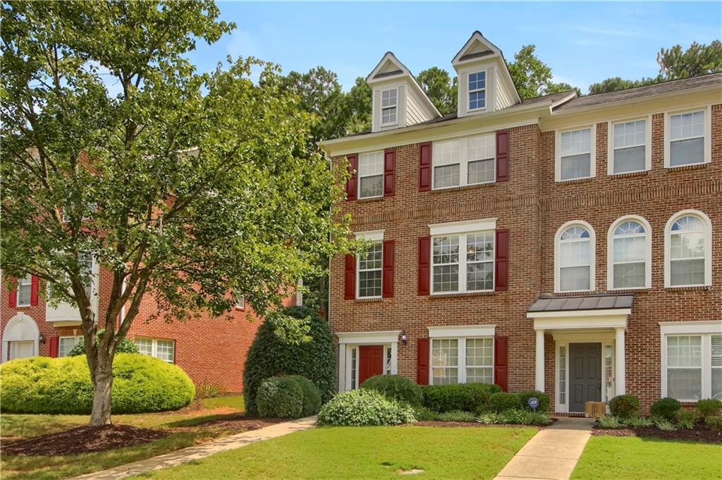 Beautiful 3-story END UNIT brick townhome in a quiet, sought-after community minutes from Kennesaw State University, Town Center, shopping, dining & parks. Easy access to I-75 & I-575. ~$50k of updates/upgrades done in the last two years. Lower level features a bedroom/office, full bath & 2-car garage entry. Main level offers an open Great Room w/fireplace, hardwood, updated kitchen w/stainless steel appliances & breakfast bar, plus a private deck & half bath. Upstairs boasts a spacious primary suite w/vaulted ceiling, walk-in closet & bath w/double vanities, soaking tub & separate shower, plus 2 additional bedrooms & full baths. No current rental cap. Ideal for first-time buyers or investors.