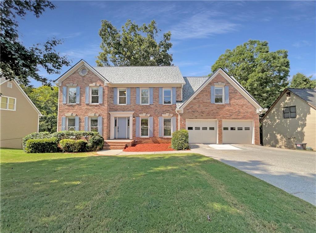 Brick-front home featuring a spacious family room with a cozy fireplace, a large eat-in kitchen, and a
separate dining room perfect for entertaining. The main level also includes a welcoming living room and
access to the back deck for outdoor enjoyment. Upstairs, the primary suite offers a walk-in closet and a
private bath with dual vanities, a soaking tub, and a separate shower. Additional highlights include a
two-car garage and an unfinished basement, providing plenty of storage or future expansion potential.