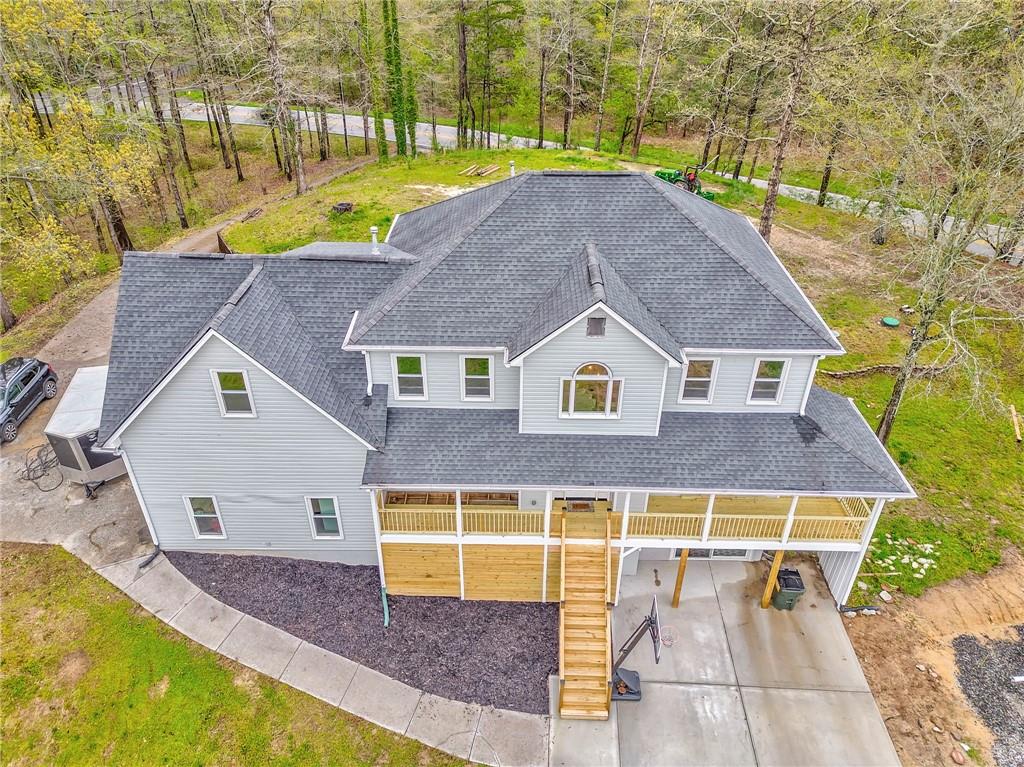 Beautiful 3 story home on 8 plus acres in the heart of Paulding County with a barn! This home offers the perfect blend of privacy, comfort, and room to roam. Whether you're looking for a peaceful countryside escape or a space to entertain and enjoy the outdoors, this one checks all the boxes! Step inside the home to discover a floor plan that features multiple level living areas, generous bedrooms and ample natural light throughout. The main level boasts of a welcoming living room, a well appointed kitchen and a spacious dining area off from the foyer. The main level also has an expansive front porch that is ideal for morning coffee or sunset views. Upstairs, you'll find cozy bedrooms and a primary suite with serene views and a private bath. The finished lower level adds even more living space, perfect for a home office, media room, guest suite or game room- let your heart guide you! Outside, the possibilities are many! With over 8 acres of beautiful land, there's room for gardens, trails, or even your own mini farm/homestead. Enjoy the peace of country living while still being within easy reach of town amenities.