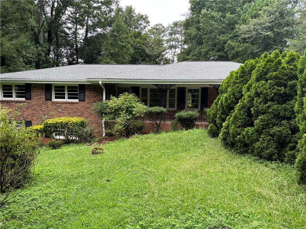 4 Sided Brick Ranch On Full Basement* Finished Area In Basement Includes 2nd Kitchen, Living Room, Bedroom, Full Bath & Laundry Space With Its Own Private Entrance* Possible Rental Or In-Law Suite* NO HOA* Located In Well Established Neighborhood* Hardwood Floors Throughout* 3 Year Old Roof* Private Lot Overlooking Beautiful Wooded Area* New Kitchen Range* Masonry Fireplace* Highly Rated Parkview High School* Great Location Close to I-85