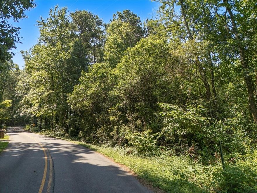 Discover a rare opportunity to create your custom dream home on this buildable 2.3-acre lot, offering a secluded and tranquil setting surrounded by established neighborhoods and upscale homes. Nestled just off Barrett Parkway and only minutes from the natural beauty of Kennesaw Mountain, this prime location combines the serenity of suburban living with unbeatable convenience. Enjoy nearby scenic walking trails, biking paths, and a variety of recreational amenities, as well as easy access to shopping and dining. This peaceful, private property is ready for your vision—an ideal canvas for your personal retreat.