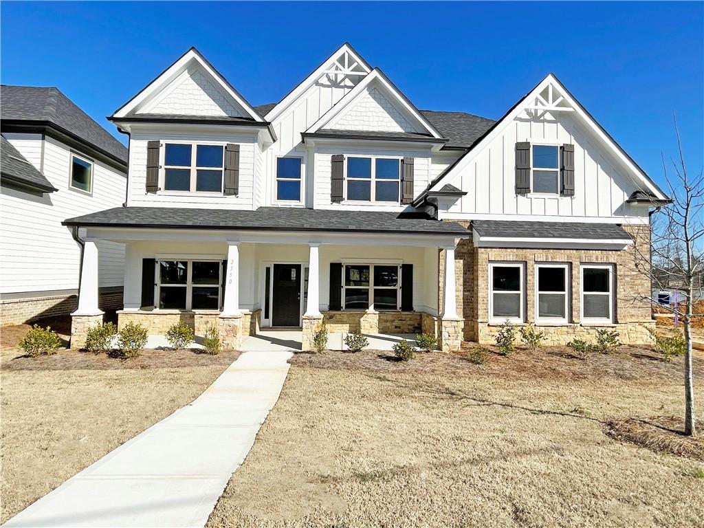 A beautiful, pretty new craftsman-style lake view house with a 4-sided stone & brick water table and two masters in Dove Lake, Grayson, GA, is available for rent. This very spacious 6 Beds + 4.5 Baths 2-story house features a gourmet kitchen with a large granite kitchen island, 42" white cabinets, tile backsplash, and stainless steel appliances. The bright kitchen is open to the breakfast area, family room, dining room with a coffered ceiling, and living/office room. One huge master with a shower and spacious closet on the main. On the second floor, the spacious master bedroom has a large closet. The master bath has a tile floor, a separate tub with tile surround, and a tile shower with a tile sitting area. One secondary bedroom with a bathroom and three additional secondary bedrooms share one bathroom. Partially covered back patio with a wood-burning fireplace. Flat and spacious lot in a great neighborhood with a spacious green space at the back and a hiking trail around the lake. Shopping and easy commute to award-winning Gwinnett County Parks.
