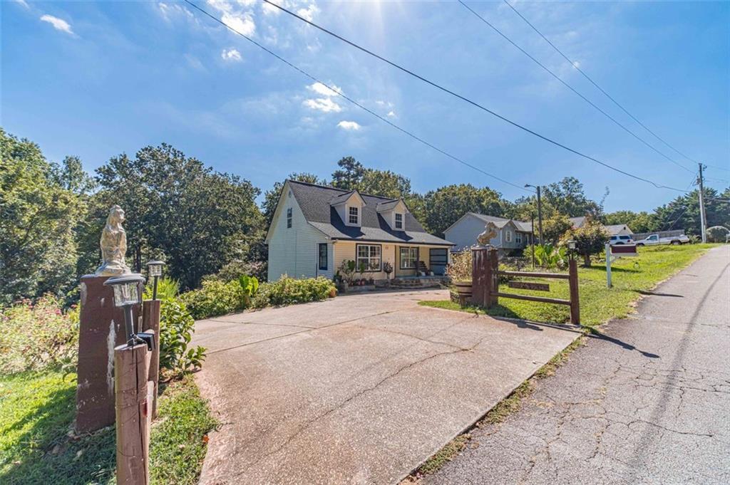 Finally, The Perfect Floor Plan on Nearly an Acre & a Half of Land With No HOA Fees or Regulations! Bring Your Boat, RV & Chicken Coop! This 3 Bed 2 Bath Home Features a Bright & Open Floor Plan + Unfinished Basement With Room to Grow! The Main Level Includes the Primary Suite + An Open Concept Living & Dining Room, & Kitchen With Door to the Deck. Washer, Dryer, & New Refrigerator Are Included! The Primary Suite Features a Sitting Room and Ensuite Bathroom. Upstairs, There Are Two Additional Bedrooms With a Shared Hall Bathroom. Don’t Forget to Check Out the Unfinished Basement With Soaring Ceilings, Just Waiting for You to Make It Your Own! This Home Is Conveniently Located In A Friendly Neighborhood, Conveniently Located Near I-985, Lake Lanier, Shopping & Dining!