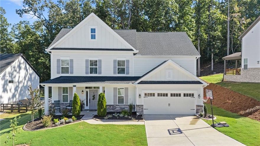 Better than new! This beautifully designed home offers 4-bedroom, 2.5-baths and features bright and airy rooms filled with natural light from numerous windows, creating a warm and inviting atmosphere throughout. The kitchen boasts an oversized island, quartz countertops, a spacious walk in pantry for all of your culinary needs, and a large dining area—perfect for everyday living and entertaining. A dedicated home office or flex space with barn doors provides privacy when needed while the versatile loft provides the ideal spot for movie nights, gaming, or a quiet place to read. The primary bedroom is generously sized with a spa like bathroom, dual sinks, large shower and huge walk in closet. All secondary bedrooms are nicely sized and include spacious closets, ensuring comfort and functionality for everyone. Additional highlights include a mudroom, extra storage in the garage, and a fully fenced backyard with an extra-large flagstone patio—ideal for entertaining or relaxing. The level, private lot backs up to Eagles Beak Park and the Etowah River, offering serene views and easy access to nature. Enjoy the neighborhood amenities, including swim, tennis, pickleball, clubhouse, and playground—all in the sought-after community of River Rock!