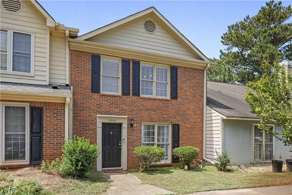Tucked into a quiet East Cobb neighborhood, this thoughtfully updated 2-bedroom, 2.5-bath townhome blends comfort, light, and modern ease. From the moment you walk in, the home feels open, welcoming, and easy to settle into.
Downstairs features durable luxury vinyl flooring, fresh neutral paint, crown molding, and a stone-accented fireplace in the living area—perfect for relaxed evenings. The kitchen offers granite counters, white cabinetry, bar seating, and stainless steel appliances, with an open flow into the dining area and sunny back room.
The sunroom is a standout—lined with windows and skylights that pour in natural light, ideal for a reading nook, playroom, or peaceful morning coffee.
Upstairs, both bedrooms are spacious with vaulted ceilings and their own private bathrooms. The primary suite bathroom features a beautifully upgraded shower with large-scale tile and glass doors, along with a modern vanity.
Private fenced yard, low HOA, and great location close to Sprayberry High School, shopping, dining, and easy access to I-75.
This home offers the space and peace you need without the upkeep you don’t.