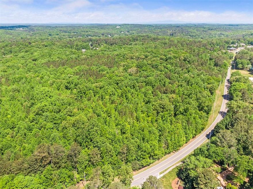 43.3 Acres in prestigious city of Milton/Alpharetta. One of the last tracts of its size in Milton. Wooded acres with spectacular hardwood trees in area of multi million dollar estate homes. Land is gentle rolling. Acreage ascend on Thompson Road. Build your private estate or multi million dollar homes. 5.85 miles from the Alpharetta Square for entertainment, shopping area w/ theatre, upscale shops, fine dining and Whole Foods. Easy access to GA 400, but all you hear are birds chirping. **Appointment necessary to walk property. Please do not walk property without making an appointment with listing agent.**