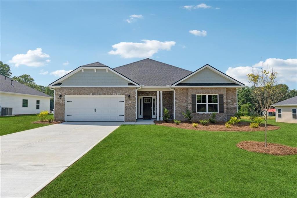 Welcome to this "Park Place Sanctuary" - A Classic and Cozy 4 Bedroom / 2 Bed - Ranch Retreat in the Park Place community! Envision waking up in your 1902 sq. ft. dream home in Park Place, affectionately known as "The Friendly City", Bowdon, GA. Designed to last and crafted with care, this home blends cozy nooks with open gathering spaces, inviting laughter, stories, and Sunday dinners. Natural light fills the walk-in foyer leading into the great open-concept family room, with a gorgeous granite countertop island awaiting your gourmet meal prep and a pantry just waiting to be filled. This beautiful split-bedroom layout offers 2 spacious secondary bedrooms and a full bath as you walk into the hallway. The amazing owner's suite has a luxurious soaking tub, a separate shower, and a walk-in closet. This thoughtfully designed space offers both privacy and connection, creating the perfect atmosphere for modern living. Home features 1 additional bedroom near the owner's suite, as it may be suitable for a nursery or study. Picture yourself unwinding on your covered lanai, overlooking a peaceful and spacious backyard for outdoor living and family barbeques. Whether hosting lively gatherings or enjoying a quiet evening, this home is designed to enhance every moment of your life. Built for quality and efficiency, "The Park Place Sanctuary" features architectural shingles for durability and two water heaters to ensure lasting comfort and peace of mind. you'll enjoy natural light throughout the day, making every room feel warm and inviting. Situated in Carroll County, minutes from I-20, local Bowdon schools, Tanner hospitals, and the University of West Georgia and West Georgia Technical College along Georgia State Routes 100 and 166, Bowdon combines small-town charm with convenient access to nearby communities, local downtown restaurants, and boutique shops. Near Carrollton Greenbelt walking trails, Little Tallapoosa, Hays Mills, and John Tanner Parks, great for outdoor life, hiking, biking, walking, boating, and fishing. USDA financing eligibility, and only $1,000 in earnest money required, making homeownership affordable and attainable. This is your opportunity to own a residence that perfectly blends style, efficiency, and affordability. Schedule your private tour today and start making memories in "Park Place Sanctuary."