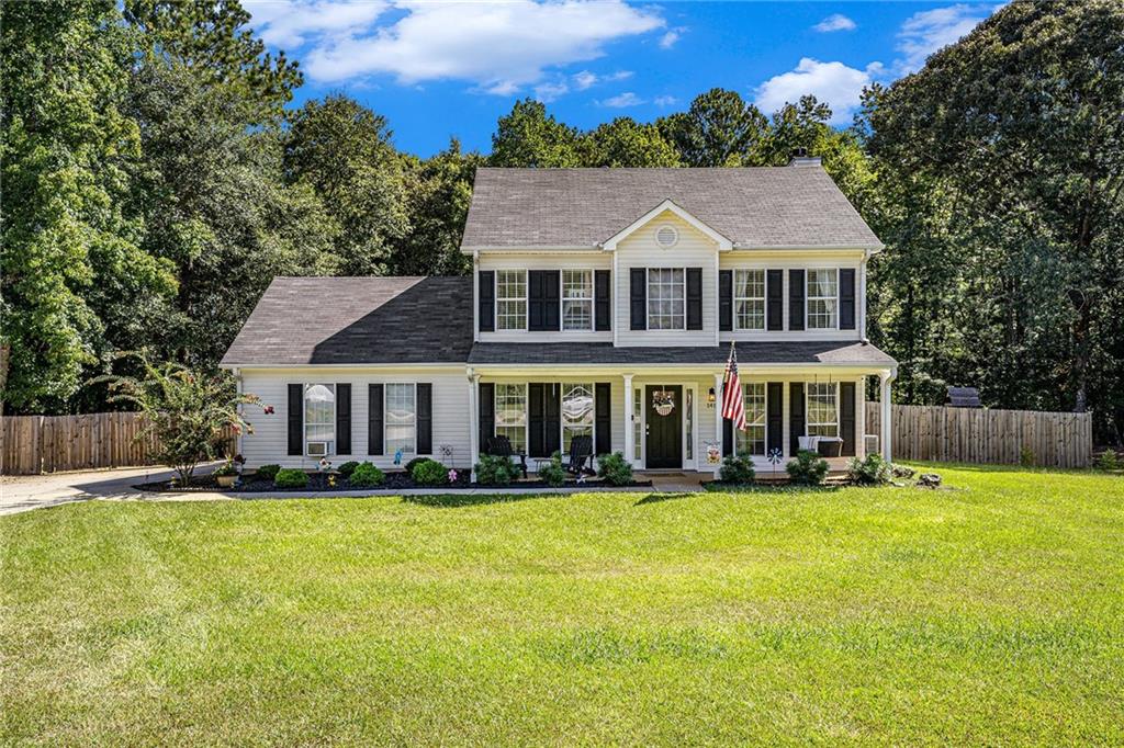 Stunning Two Story Beauty In Quiet Cul De Sac! SITUATED ON OVER 1.50 ACRES! This meticulously maintained home is designed for comfort, functionality, and entertaining. You will enter on newly installed modern laminate flooring that flows throughout the entire home. The formal dining room greets you as you move to the designer kitchen. The eat in kitchen features stunning cabinetry, a coffee bar area and overlooks the inviting family room. Off the kitchen is also an enclosed sunroom -perfect for peaceful mornings, sunny afternoons, and evening sunsets, upstairs the primary bedroom is large expertly designed with access to the upper level deck; ensuite has a tiled stand up shower, dual sinks and two closets including a large walk-in. The secondary bedrooms are spacious with ample closet space. Enjoy modern laminate flooring throughout. Step outside to a large deck, perfect for gatherings, and cool off in the above-ground pool while taking in the peaceful surroundings. This home truly has it all!