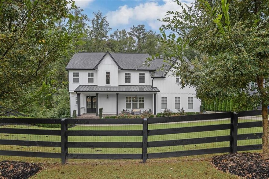 Welcome to this like-new modern farmhouse, perfectly situated on a quiet cul-de-sac in the coveted Tritt/Hightower/Pope school district. Set on a half-acre lot, this 5-bedroom, 4.5-bath home blends timeless style with today’s most sought-after finishes. Step inside to an open, light-filled floor plan featuring hardwood floors and designer fixtures throughout. The show-stopping kitchen is the heart of the home with an expansive island, quartz countertops, marble backsplash, high-end appliances, and seamless views into the family room and dining areas. A spacious mudroom keeps life organized, and leads to the side facing 3-car garage, A newly built screened-in porch - complete with space for dining and lounging around the outdoor fireplace - makes everyday living feel like a retreat. The primary suite is a true sanctuary with a spa-like bath offering dual vanities, a free-standing tub, glass-enclosed shower and a DREAM closet that holds as many clothes and shoes as your heart desires! The finished basement expands your living options with a large family room, game/bar area, workout room or bedroom, and full bath. Outdoors, the newly landscaped backyard is fully fenced and features turf, a firepit area, and plenty of space for play. Located in a friendly neighborhood with an optional HOA offering pool and tennis amenities, this home delivers the perfect blend of comfort, community, and convenience.