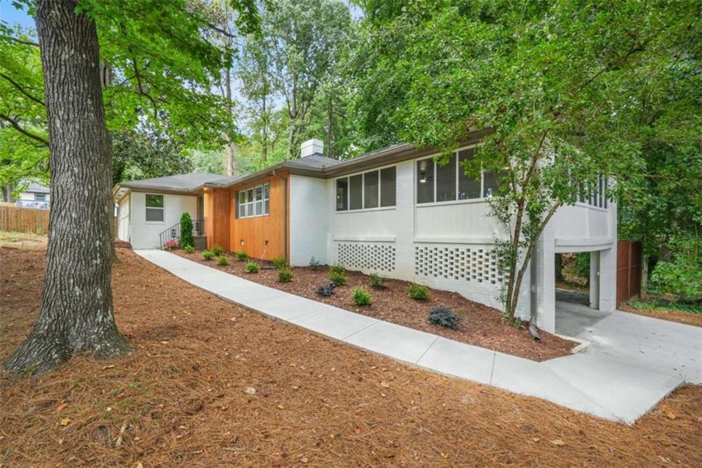 Beautifully Renovated 3-Bedroom, 2-Bathroom Home on Half an Acre Oasis in Sandy Springs, GA Welcome to 5975 Brookgreen Rd, a stunning 3-bedroom, 2-bathroom home in the heart of Sandy Springs, GA. Meticulously renovated with modern upgrades throughout, this charming home offers 1,717 sq ft of living space, combining contemporary elegance with transitional comfort. Located on a quiet, private half-acre corner lot, it provides the perfect blend of tranquility and convenience. Key Features: * Hardwood Floors: Beautiful, durable hardwoods throughout the living areas and bedrooms adding warmth and sophistication. * Renovated Throughout: New tile flooring, fixtures, and finishes have added fresh, stylish touch to every room. * Spacious Sunroom & Patio: Enjoy abundant natural light in the sunroom, perfect for relaxation or as a home office. The outdoor patio is ideal for entertaining or dining al fresco. * Gourmet Kitchen: Fully upgraded with all new high-end appliances, custom cabinetry, and sleek countertops. Perfect for culinary enthusiasts. * Primary Suite with Custom Closet: The primary bedroom features a custom-designed walk-in closet for ultimate organization and convenience. * Luxurious Spa-Like Bathroom: The primary bath features a modern walk-in shower, offering a serene retreat after a long day. * Brand-New Systems: Newly installed A/C, water heater, and furnace ensure years of worry-free comfort. * Newly Paved Driveway: Freshly paved for enhanced curb appeal and easy access. * New Interior and Exterior Paint: Both the interior and exterior have been freshly painted to enhance the home's visual appeal. Community & Location: This home is ideally situated within close proximity to excellent schools, parks, and a variety of shopping and dining options. Enjoy convenient access to Roswell Road, and take advantage of nearby Sandy Springs amenities, including: * Sandy Springs Perimeter Center: A hub for business, shopping, and dining, just minutes away. * Shops at Abernathy Square: A short drive to retail outlets and trendy dining spots. * Parks & Green Spaces: Explore nearby Abernathy Greenway Park and Morgan Falls Overlook Park, perfect for hiking, biking, and family outings. Nearby Hospitals & Healthcare: * Northside Hospital - Just a short drive away for convenient access to medical services. * Emory Saint Joseph's Hospital - Located nearby, offering comprehensive healthcare. Of note: Northside Hospital and Emory St. Joseph's Hospitals are touted as the best in Atlanta for Heart, Cancer and Maternity Care. Easy Access to Major Highways: * Minutes from I-285 and GA-400, offering a quick commute to downtown Atlanta, Buckhead, and the greater metro area. Whether you're looking for a peaceful retreat with modern amenities or a conveniently located home near everything Sandy Springs has to offer, this beautifully renovated property is the perfect fit. Schedule a tour today to experience the charm and elegance of 5975 Brookgreen Rd in person!