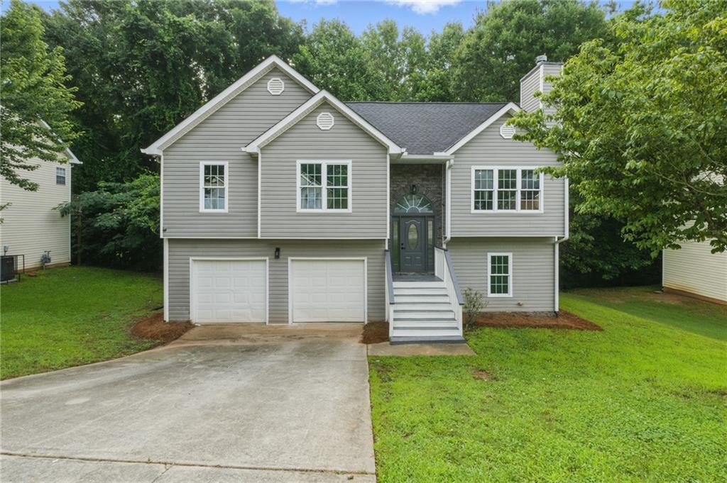 Stunningly renovated 4 bed/3 bath home featuring brand new Luxury Vinyl Plank flooring, new interior paint, new lighting and plumbing fixtures everywhere, and new stainless-steel appliances. Enter into the large living room with fireplace and open concept views to the kitchen. Kitchen offers granite, plenty of cabinets and countertops space, an island with overhang perfect for barstools, new stainless steel appliances, and eat-in kitchen. Huge Master bedroom offers an En-suite with walk in shower, double vanity with new granite, and low flow toilet. Two good sized secondary bedrooms and secondary bathroom with tub/shower combo, low flow toilet, and new granite. Large finished basement offers a den/recreation room/bonus room with sink and beverage fridge along with 4th bedroom and 3rd full bathroom with walk in shower, new granite, and low flow toilet. Out back the large deck overlooks private backyard.