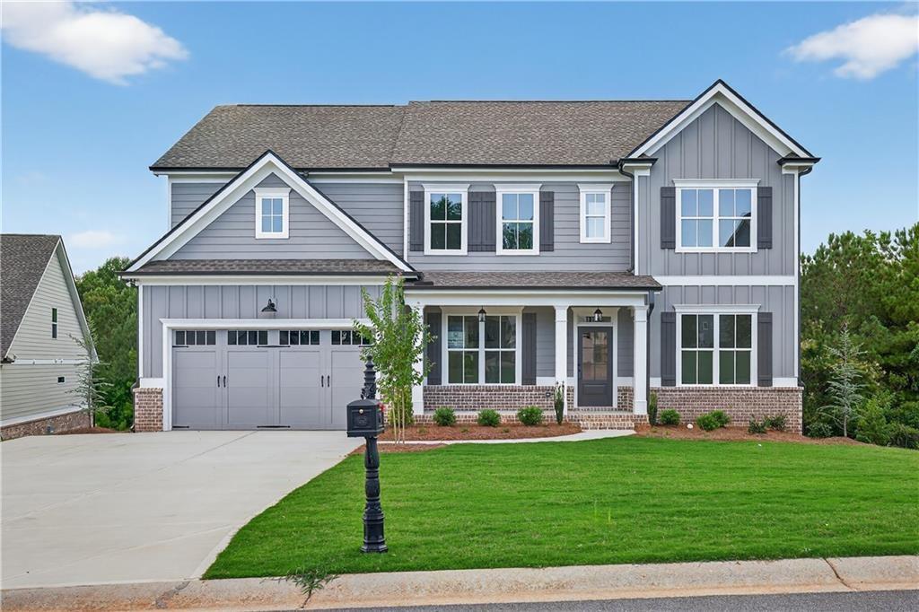 “LOT 159Q/JACKSON PLAN” Another impressive home in Traditions of Braselton by Hillgrove Homes! This floorplan boasts 5 bedrooms, 4 full baths and has all the designer touches. The spacious Gourmet Kitchen w/ oversized island overlooks the inviting Family Room. Coffered ceilings, shiplap, brick fireplace, cedar mantle and built-in cabinetry complete this space. The Kitchen features custom painted cabinetry w/ soft-close drawers, quartz or granite countertops, stainless steel appliances, tile backsplash, farm sink and spacious walk-in pantry. A Dining/Office/Flex Space and Study right off the Foyer boasts an extensive trim package. The oversized Primary Suite & Primary Bath add SO much space to this home and are complete with an oversized super shower and soaking tub, upgraded cabinetry and countertops, dual sinks and upgraded tile. Large secondary bedrooms (one full bed/bath on main level), closets & bathrooms are an extra perk. The covered back porch w/ fireplace is perfect for entertaining or back porch sitting! GOLF CART GARAGE! Sought-after Jackson County School System. Traditions of Braselton awards you swim/tennis/golf/restaurant/clubhouse/fitness facility and more. Endless activities for the amenity rich community seeker.