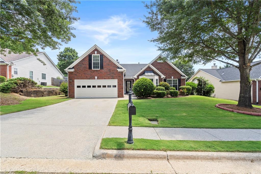 Welcome to 141 Carleton Gold Trail in Dacula—a beautifully maintained, move-in ready ranch-style home offering 4 bedrooms and 2.5 baths. This spacious, single-level property sits on a large, level lot with a private backyard perfect for entertaining, gardening, or relaxing.
Inside, you'll find a light-filled open layout with fresh interior paint and updated flooring. The renovated kitchen features granite countertops, stainless steel appliances, modern backsplash, and generous cabinet space—ideal for everyday cooking and entertaining. The family room flows seamlessly from the kitchen, creating an inviting and functional living space. The oversized owner’s suite includes a walk-in closet and an en-suite bath with double vanities, soaking tub, and separate shower. Secondary bedrooms are well-sized and offer flexibility for guests, office, or playroom. Additional upgrades made by the seller include newer HVAC, smart thermostat, updated lighting, custom blinds, freshly painted exterior trim, and improved landscaping for curb appeal.
Conveniently located near parks, schools, shopping, and commuter routes, this home offers comfort, style, and easy access to everything Dacula and the greater Atlanta area has to offer.
