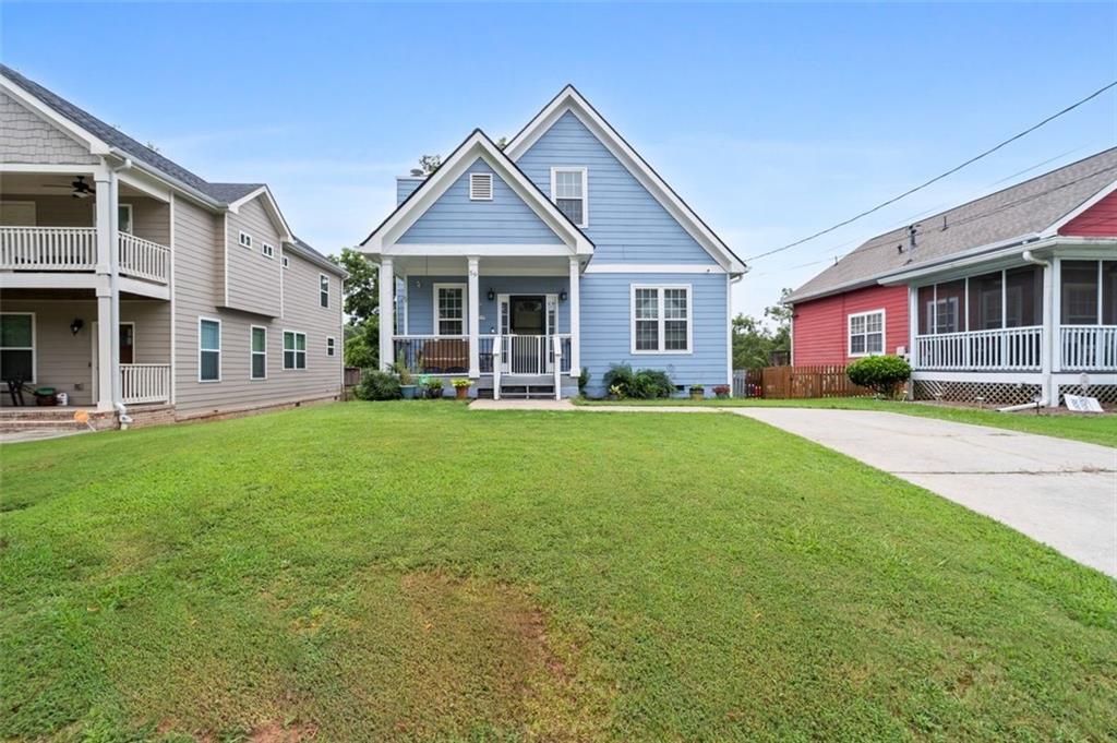Absolutely gorgeous affordable luxury 4-bedroom 3-Bath Craftsman two story home perfectly located in the heart of Atlanta (Campbell Wallace Jr/Subdivision) with no HOA. You can chat with your neighbors on the spacious front porch. Come inside to this open spacious open floor plan. This home has beautiful hardwood floors throughout with plenty of natural light. You will find an open spacious concept family room and kitchen with breakfast bar and formal dining area. Also, there are 2 full bathrooms on the first floor with standup shower in the main bedroom. Upstairs there are 3 good size bedrooms with a full bath. There is a large partially screened deck off the kitchen, which is great for relaxation and entertaining guest. Great size leveled fenced back yard. Minutes from Downtown Atlanta, Grant Park, Marta access, Atlanta Airport and conveniently situated near the Beltline. This is an easy commute with 3 major highways. Home is priced to sell fast so schedule your showing today.