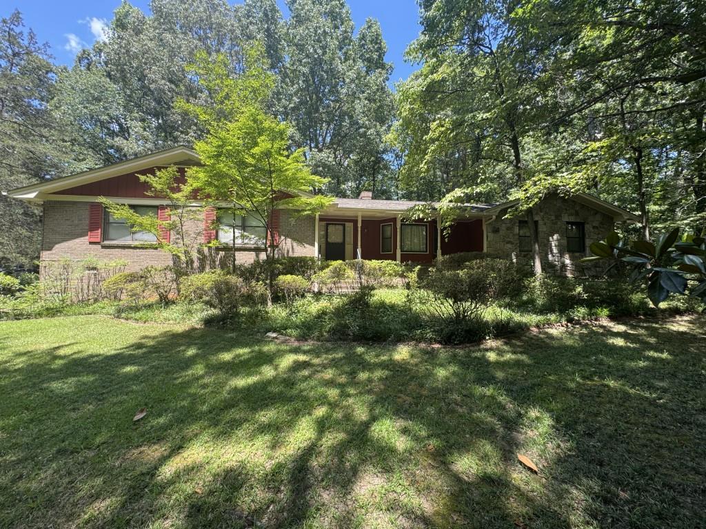 This 3-bedroom, 2.5-bath, four-sided brick ranch-style home features both a basement and a crawl space. Offered as an "as is" estate sale, the property needs some repairs and updates including carpet, painting, and flooring. The seller will make no repairs prior to closing. The seller requires that all buyers personally view the property before submitting a written contract. Situated on .76 acres, the property boasts a spacious front yard with mature trees that create a canopy over the long driveway. From various points in the kitchen, you'll enjoy views into the family room, dining room, and living room. The home is conveniently located near Scenic Hwy 124 and Sugarloaf Parkway. Again, this house is being sold as is.