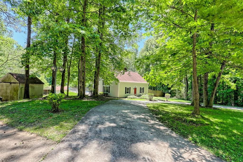Welcome Home! This 4 Bed/3 Bath property has everything! Need Privacy? This serene retreat is situated on 2 parcels, spanning a total of 2.58 acres. Need to cool off? Take a dive into the swimming pool! Need storage space? This property boasts a storage shed and a 26x40 pole barn which can be utilized for RV Storage, parking cars, and/or a workshop. Don't miss an opportunity at an amazing piece of property at an incredible price!