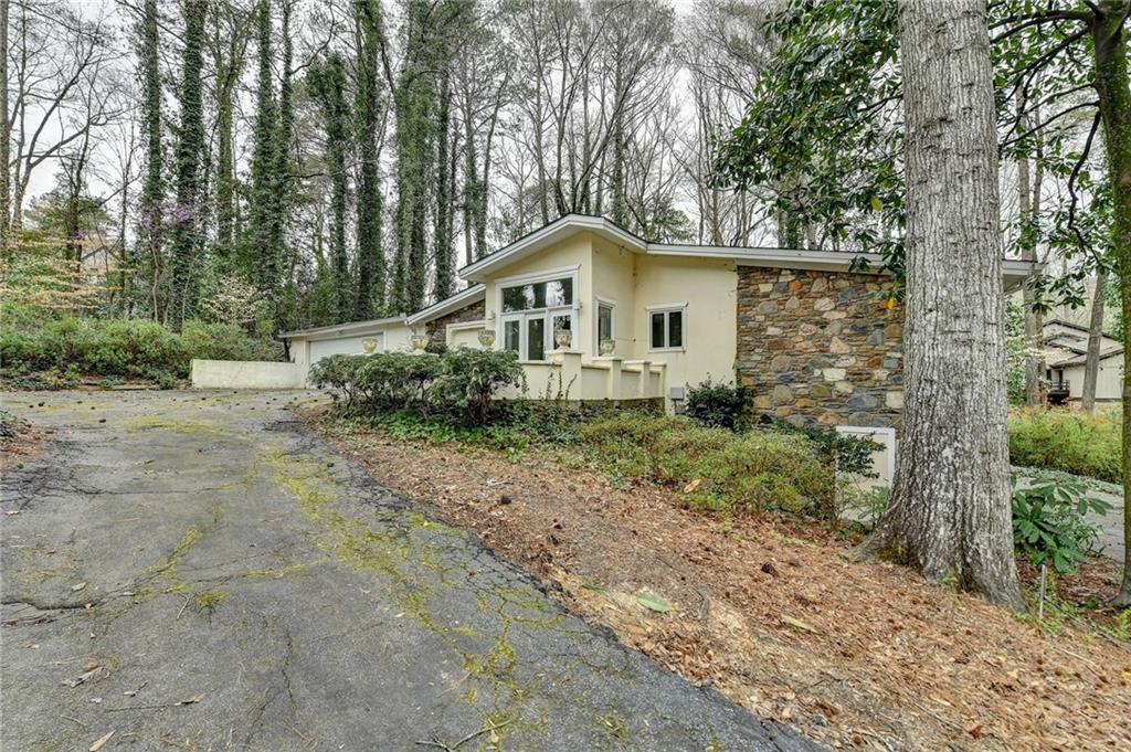 Welcome to 4900 Northland Dr, Atlanta, GA—a stunning 4-bedroom retreat offering a rare blend of privacy, serenity, and convenience. Nestled in a highly sought-after community with top-rated schools, this home boasts a secluded feel while remaining just minutes from the best of Atlanta. A picturesque stream runs in front of the property, adding to the tranquil ambiance. Inside, you’ll find spacious living areas, elegant finishes, and an ideal layout for both relaxing and entertaining. The expansive primary suite, well-appointed kitchen, and inviting outdoor spaces make this home a true gem. This unique floor plan features 2 bedrooms on the main level, 2 bedrooms on the lower level/2.5 bathrooms on the main floor, and 1 full bathroom on the lower level.
Don’t miss this unique opportunity to experience the perfect balance of nature and city living. Schedule your tour today!